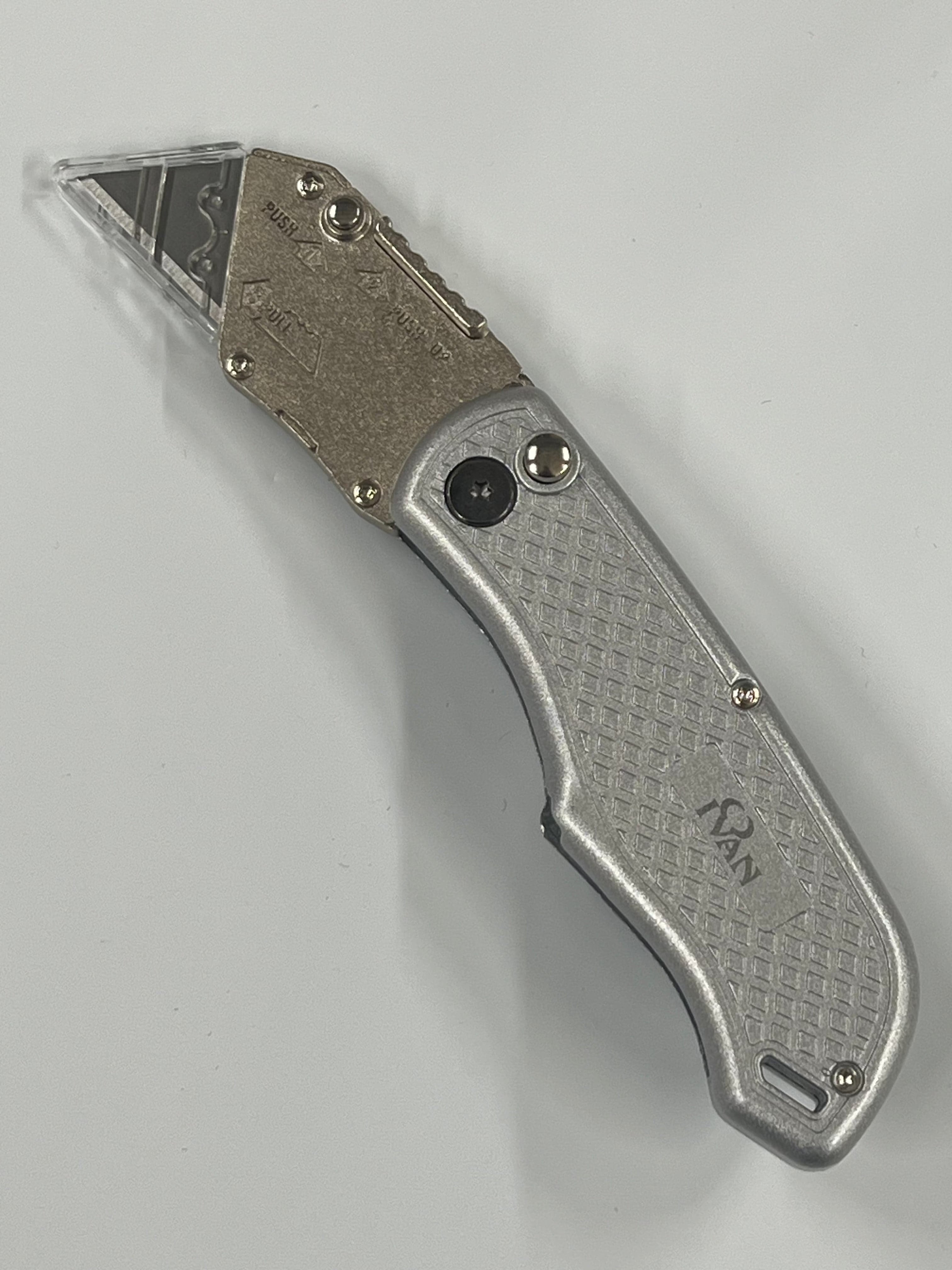 Folding knife with replaceable blade and belt clip