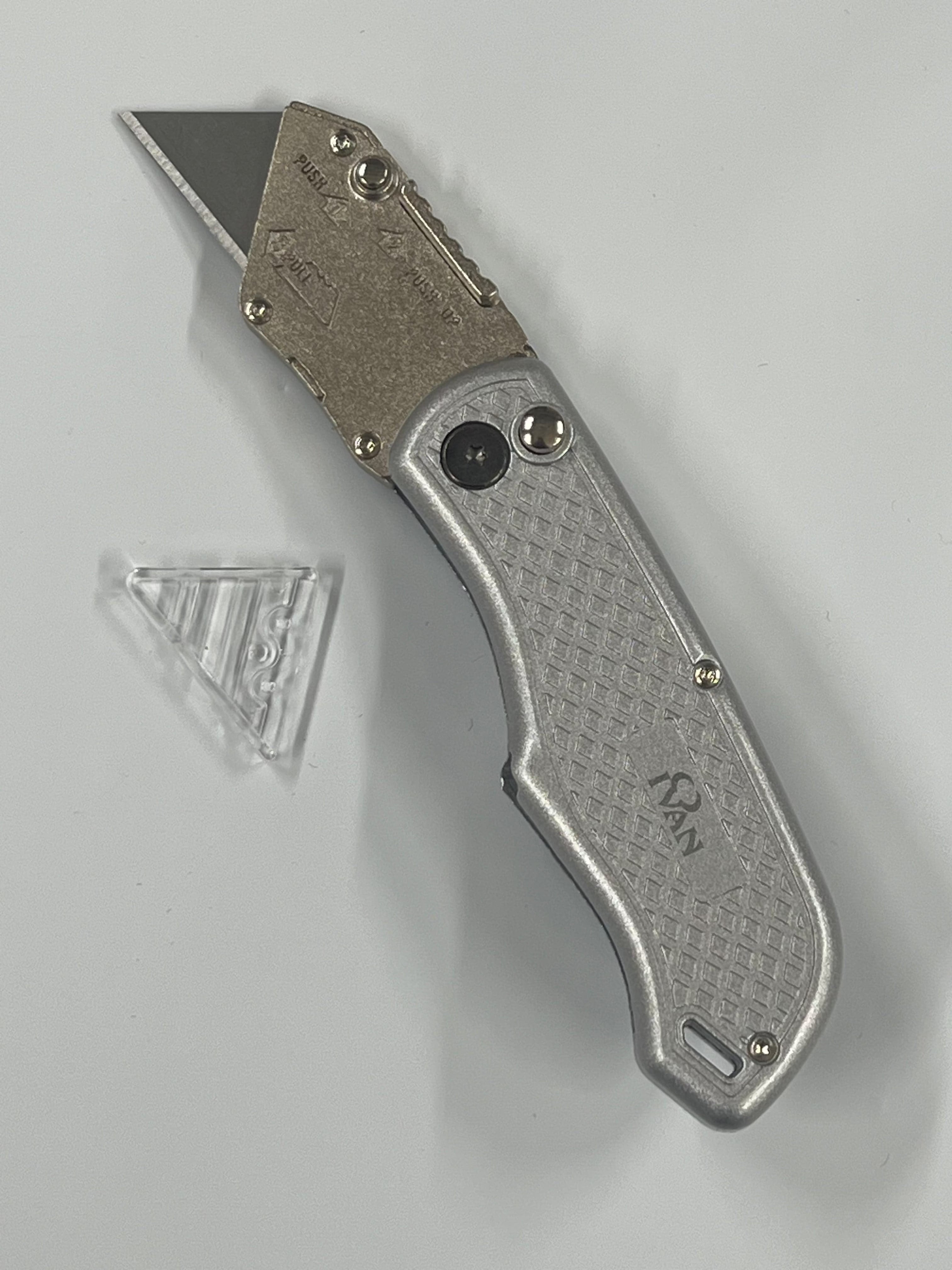 Folding knife with replaceable blade and belt clip