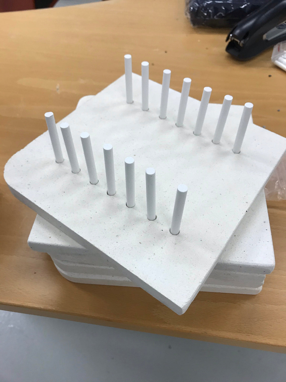 Knife blade holder for curing oven